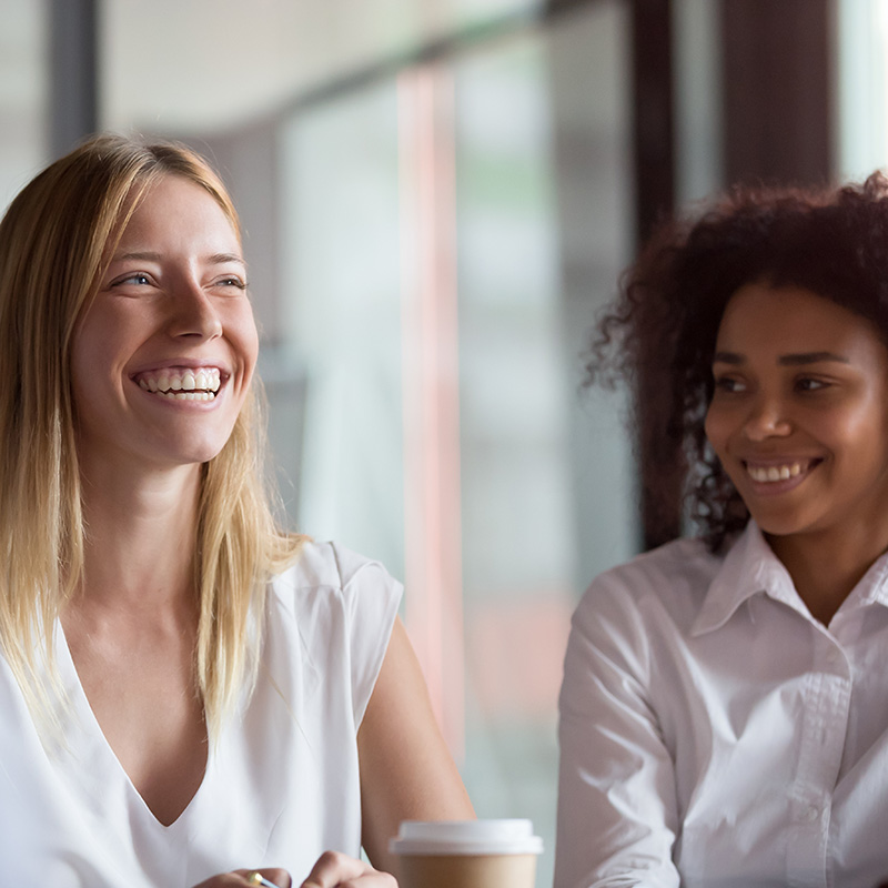 Two woman laughing.